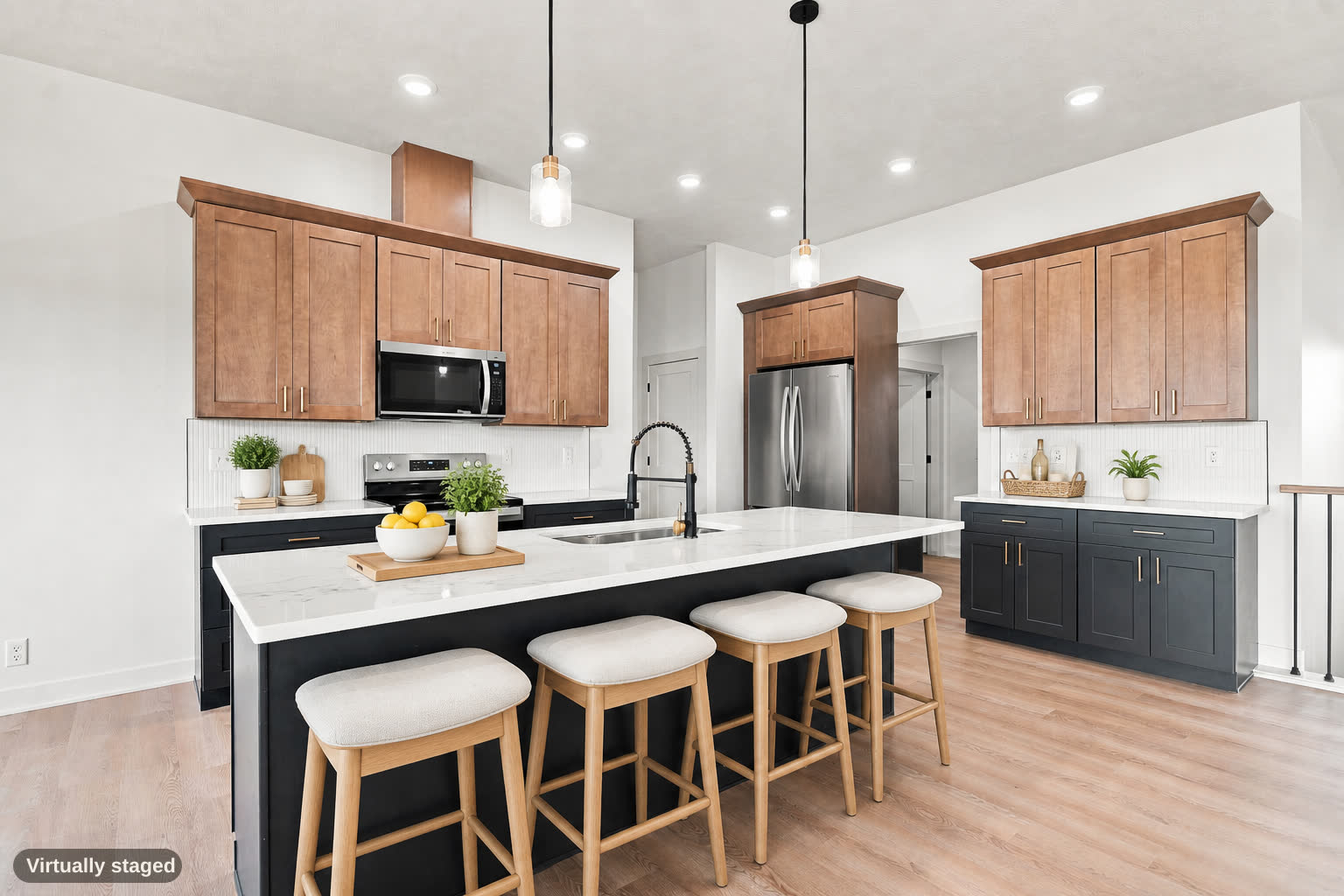Same kitchen, virtually staged, island at center.