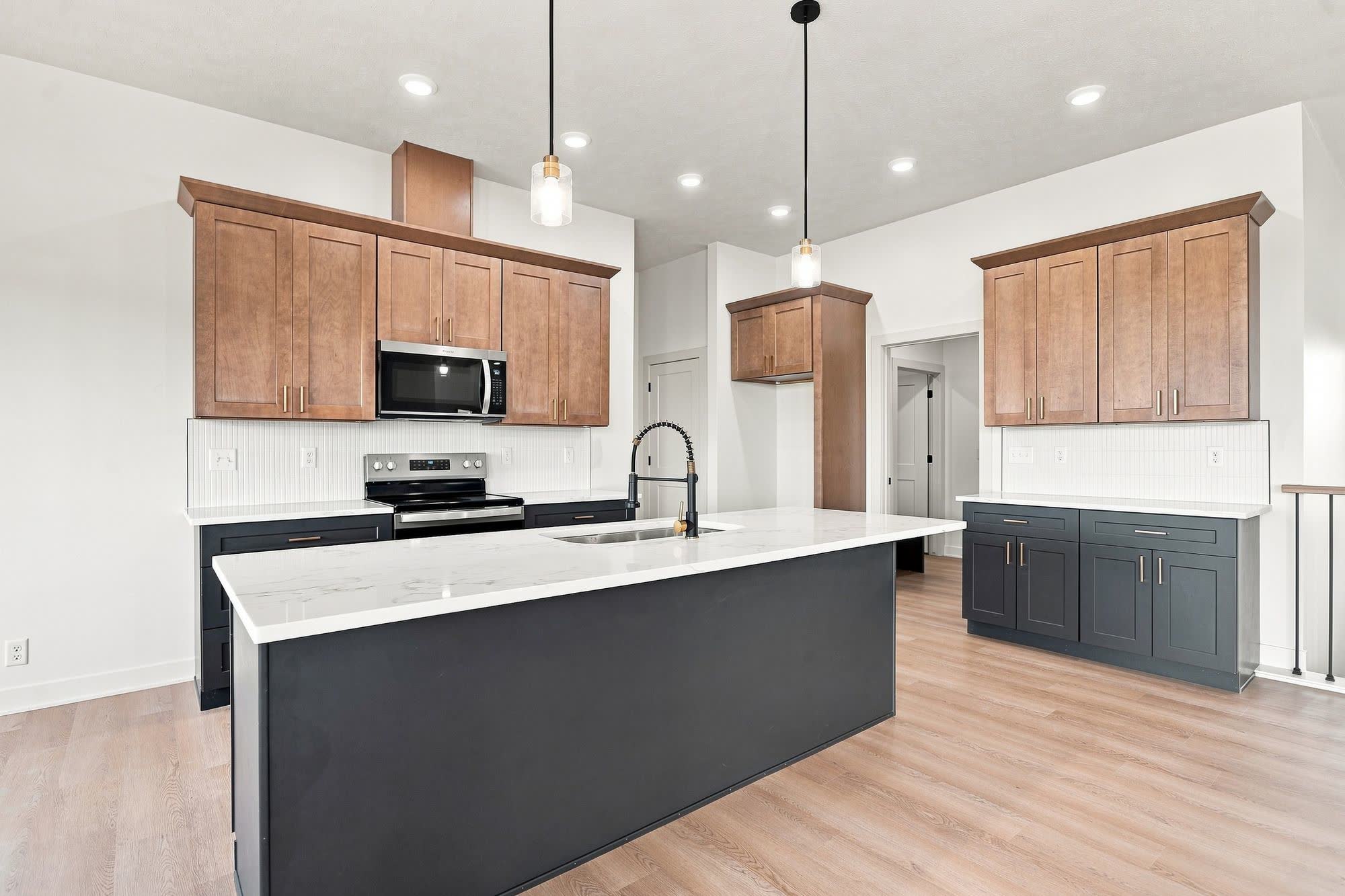 Empty kitchen centered on the island.
