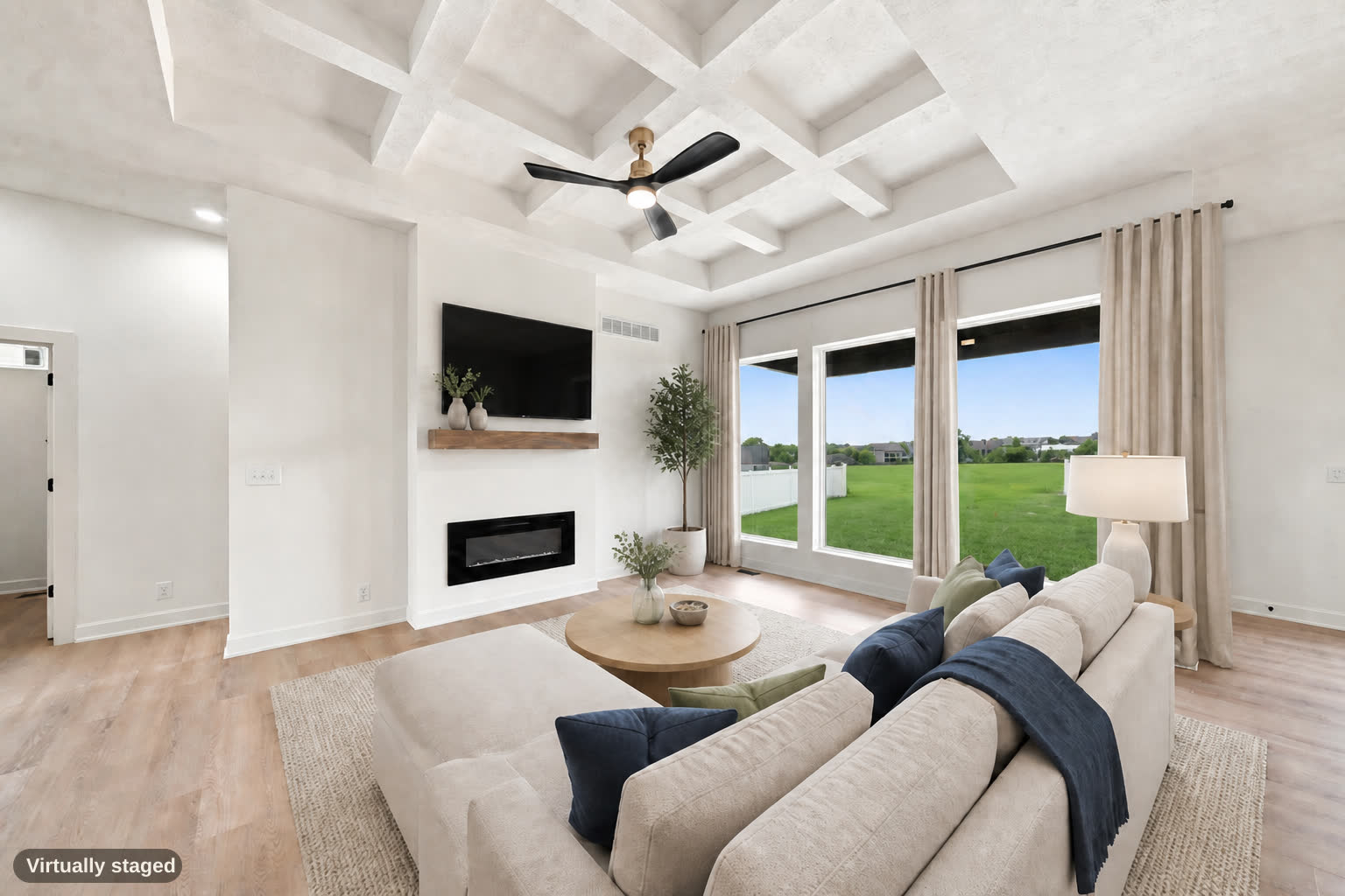 Same living room, virtually staged, three windows.